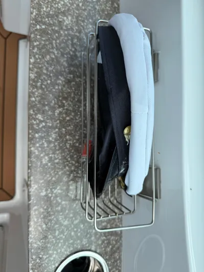 Evelyn Yacht Photos Pics Captain hats stored on a J Boats J/9, 2022 model, with a textured surface.