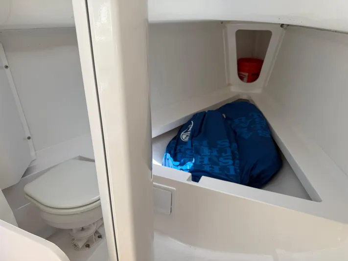 Evelyn Yacht Photos Pics 2022 J Boats J/9 interior cabin with toilet and storage area.