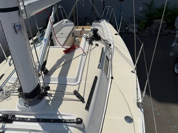 Evelyn Yacht Photos Pics 2022 J Boats J/9 sailboat deck with rigging and mast, docked outdoors.