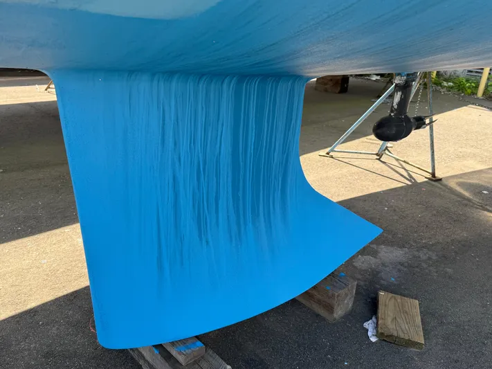 Evelyn Yacht Photos Pics Blue keel of a 2022 J Boats J/9 sailboat on a stand.