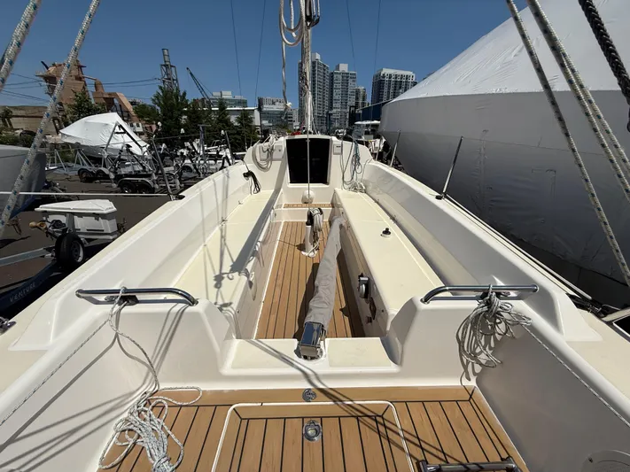 Evelyn Yacht Photos Pics 2022 J Boats J/9 sailboat with spacious deck and modern design, docked in a marina.