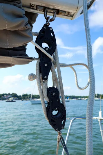 Evelyn Yacht Photos Pics Pulley system on 2022 J Boats J/9 sailboat with scenic water background.