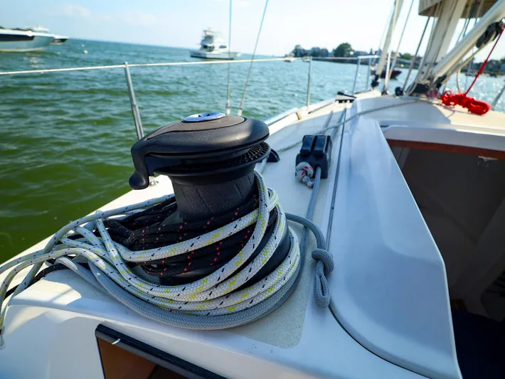 Evelyn Yacht Photos Pics 2022 J Boats J/9 sailboat deck with winch and ropes, sailing on calm waters.