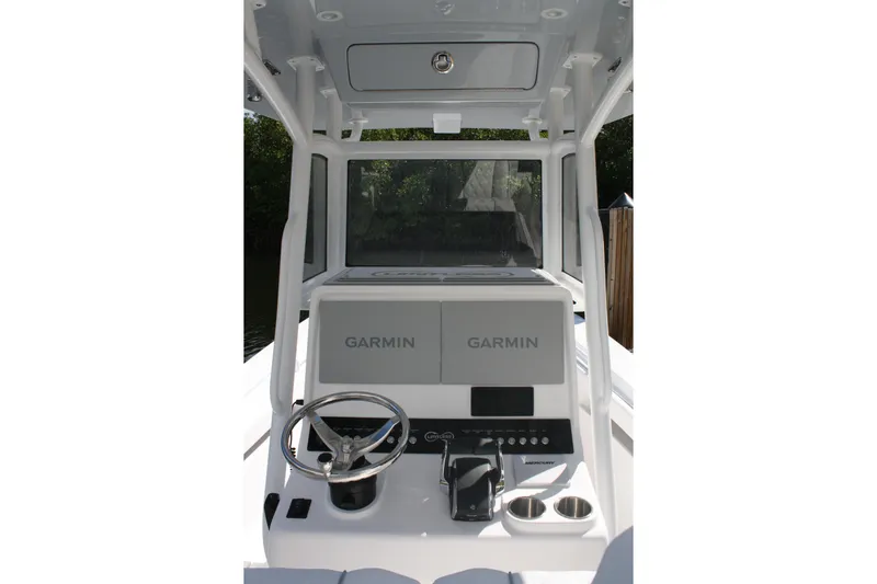  Yacht Photos Pics Limitless 270 boat console with Garmin displays, steering wheel, and controls, 2026 model.