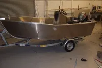 2024 Robust Boats Robust 16c on trailer in workshop setting.