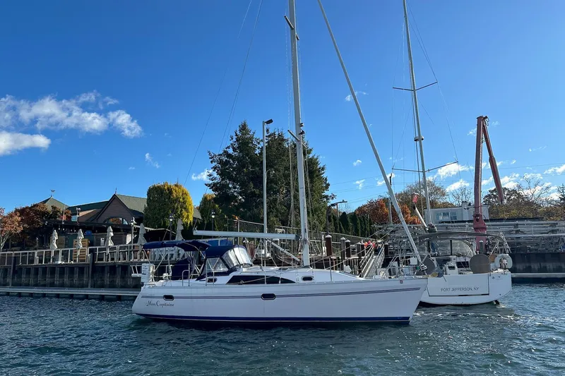  Yacht Photos Pics 2015 Catalina 315 sailboat docked at a marina under a clear blue sky.