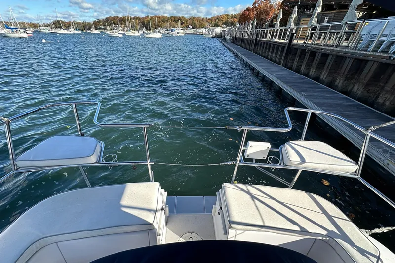  Yacht Photos Pics View from a 2015 Catalina 315 sailboat, overlooking a marina with calm waters.