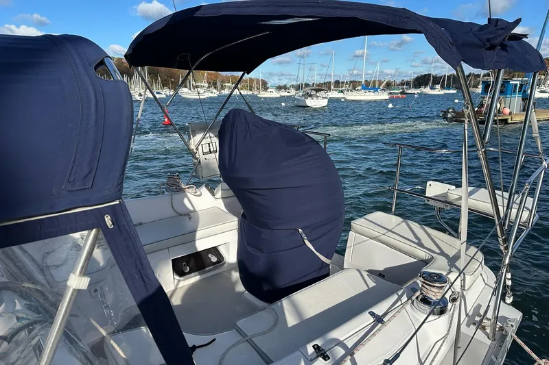  Yacht Photos Pics Sailboat Catalina 315, 2015 model, docked with covered helm, surrounded by marina.