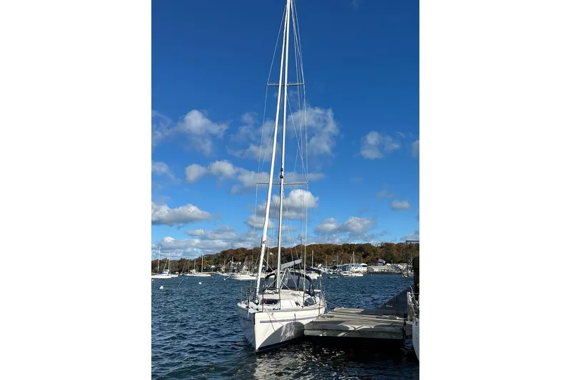  Yacht Photos Pics Sailboat Catalina 315, 2015 model, docked in a scenic marina under a clear blue sky.
