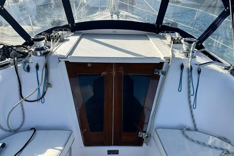  Yacht Photos Pics Cockpit of 2015 Catalina 315 sailboat with ropes and wooden hatch.
