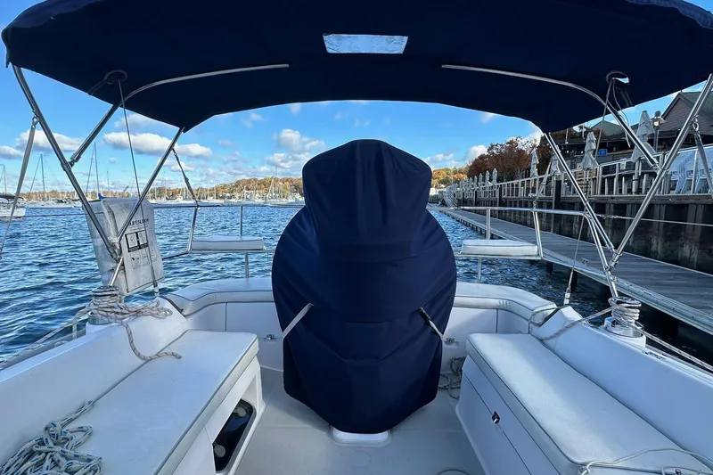  Yacht Photos Pics Cockpit view of a 2015 Catalina 315 sailboat docked by a marina.