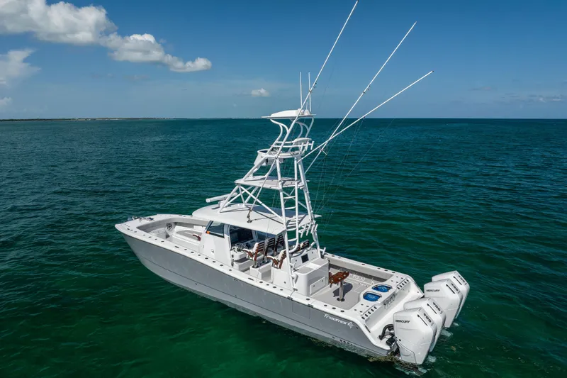  Yacht Photos Pics 2024 Freeman 43 boat on open sea with clear blue skies.