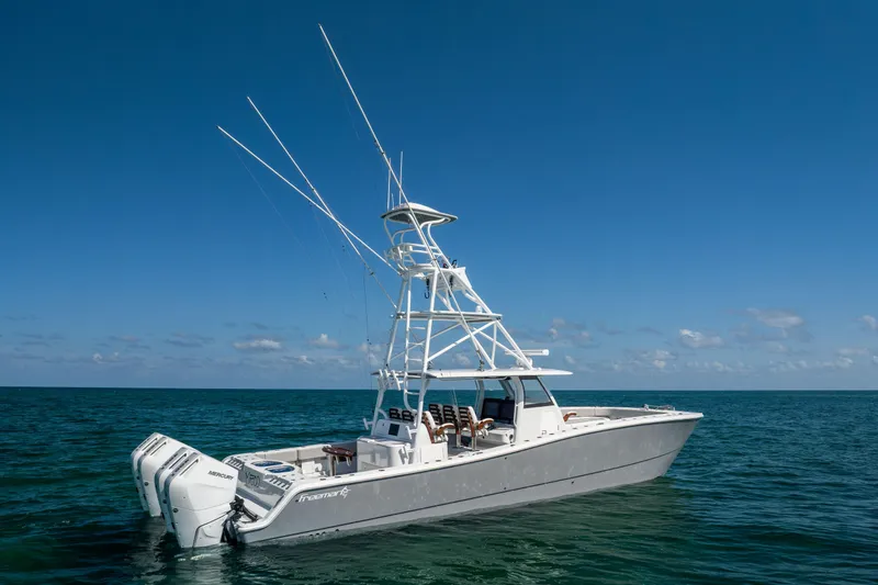  Yacht Photos Pics 2024 Freeman 43 boat on open sea with clear blue sky.
