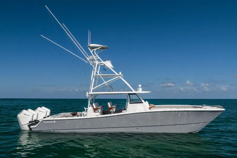  Yacht Photos Pics 2024 Freeman 43 boat on open water under clear blue sky.
