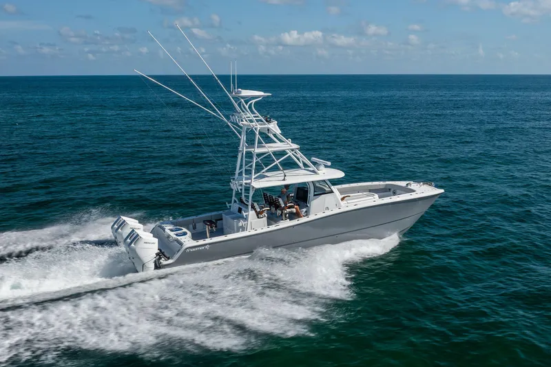  Yacht Photos Pics 2024 Freeman 43 boat cruising on open ocean under clear skies.