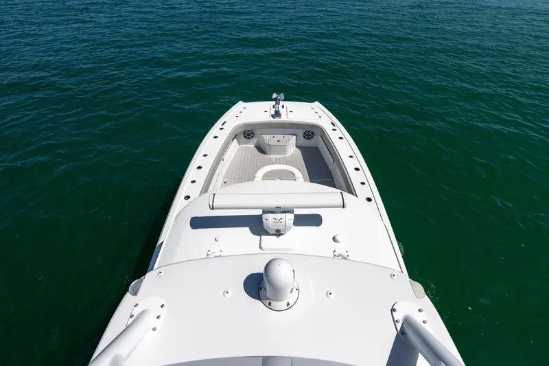  Yacht Photos Pics 2024 Freeman 43 boat on calm water, showcasing sleek design and spacious deck.