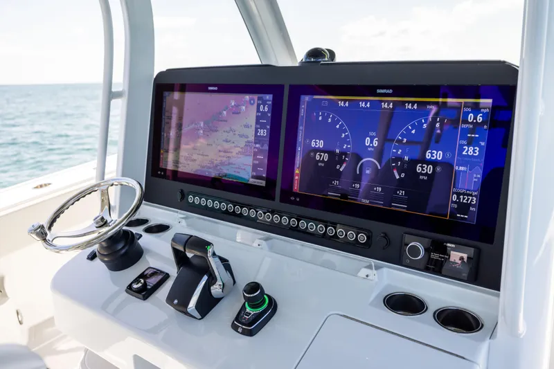  Yacht Photos Pics Freeman 43 boat dashboard with dual Simrad displays, steering wheel, and controls, 2024 model.