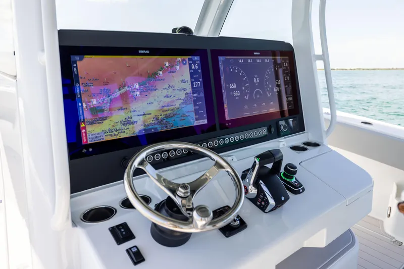  Yacht Photos Pics 2024 Freeman 43 boat dashboard with dual Simrad displays and steering wheel.