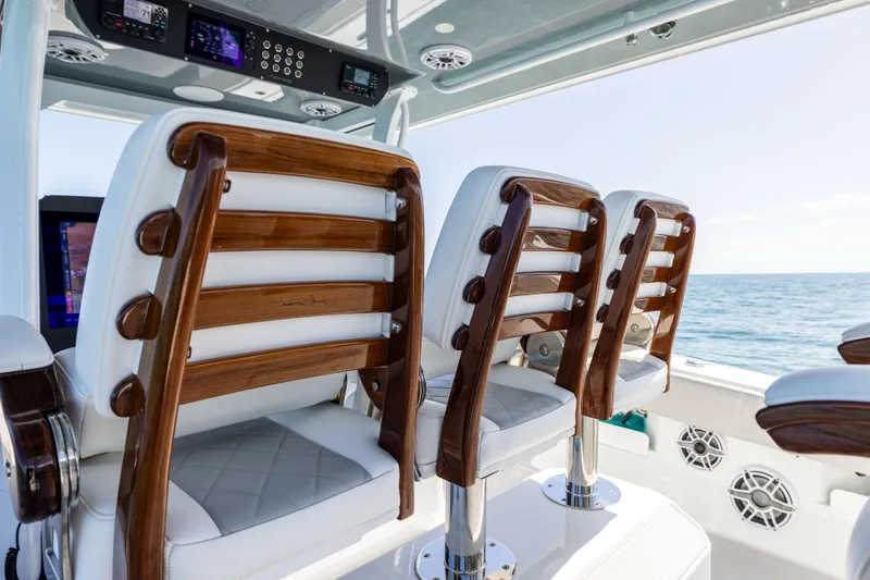  Yacht Photos Pics 2024 Freeman 43 boat interior with elegant wooden and white leather seating.