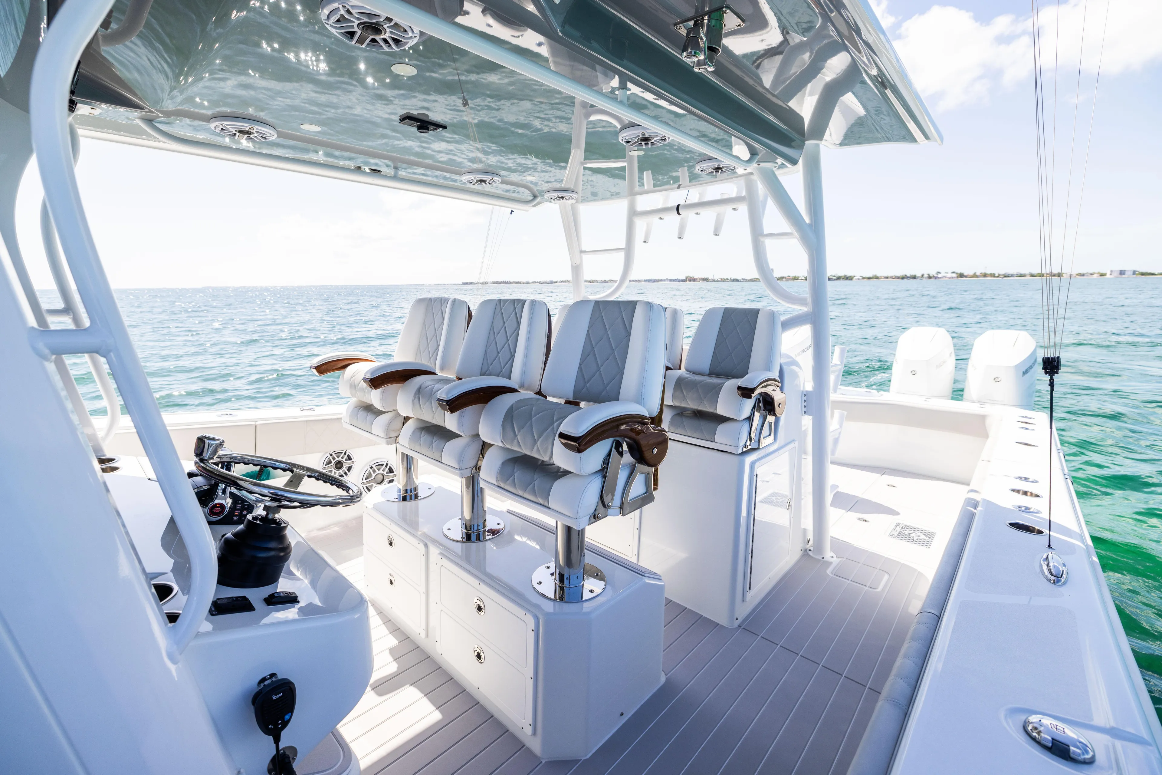  Yacht Photos Pics Luxurious 2024 Freeman 43 boat interior with plush seating and ocean view.