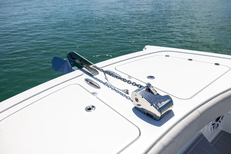  Yacht Photos Pics 2024 Freeman 43 boat anchor system on deck, floating on calm water.