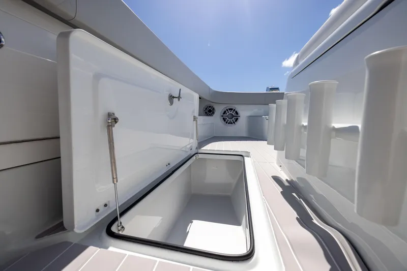  Yacht Photos Pics Open storage compartment on 2024 Freeman 43 boat under clear blue sky.