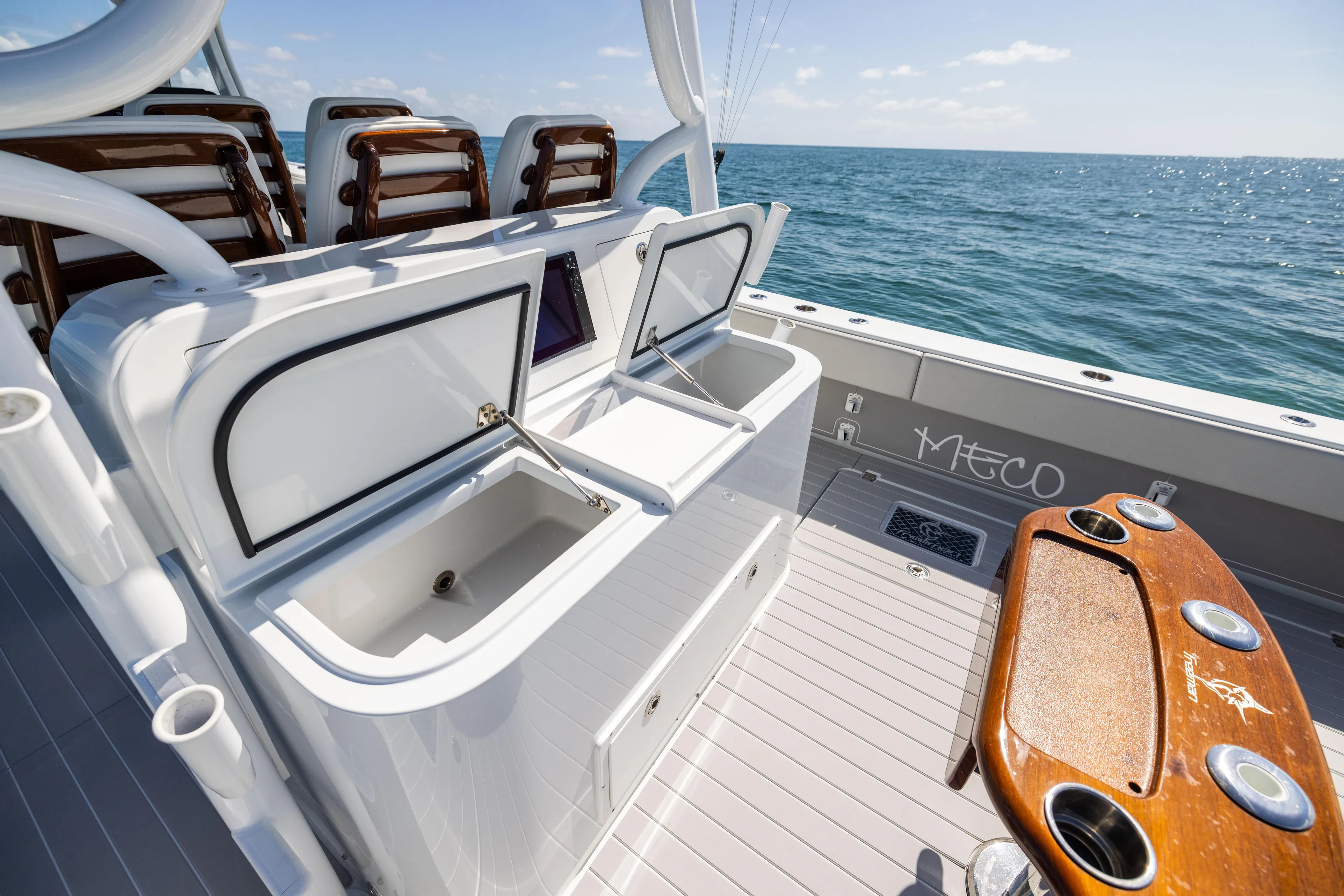  Yacht Photos Pics 2024 Freeman 43 boat deck with open storage compartments and ocean view.