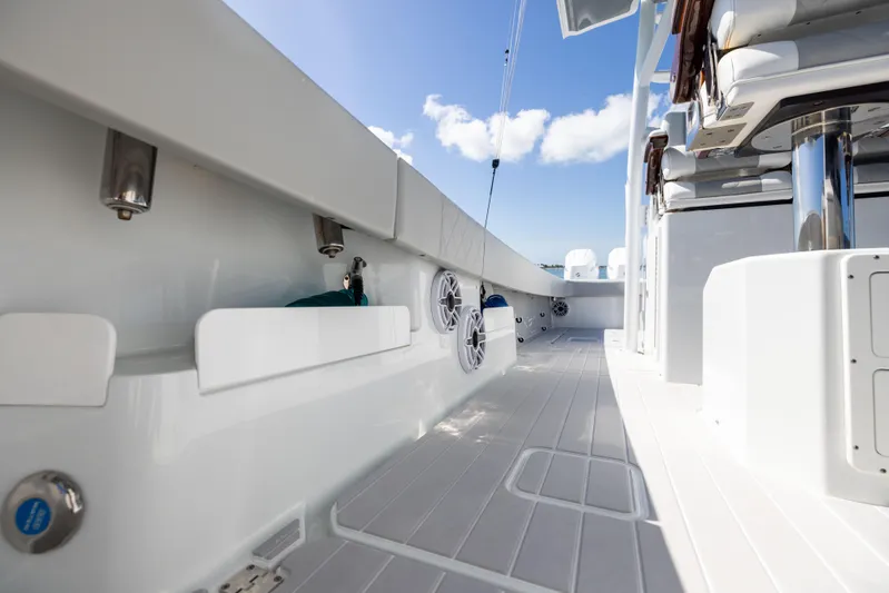  Yacht Photos Pics 2024 Freeman 43 boat deck with modern seating and sleek design under blue sky.