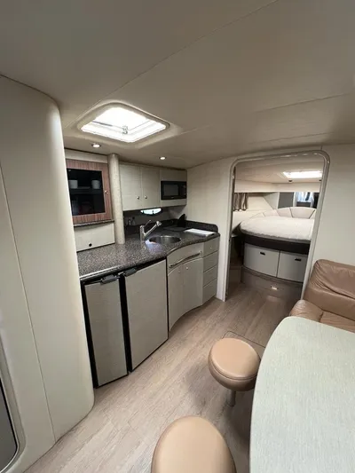  Yacht Photos Pics Interior of 2006 Formula 40 Performance Cruiser with modern kitchen and cozy seating area.