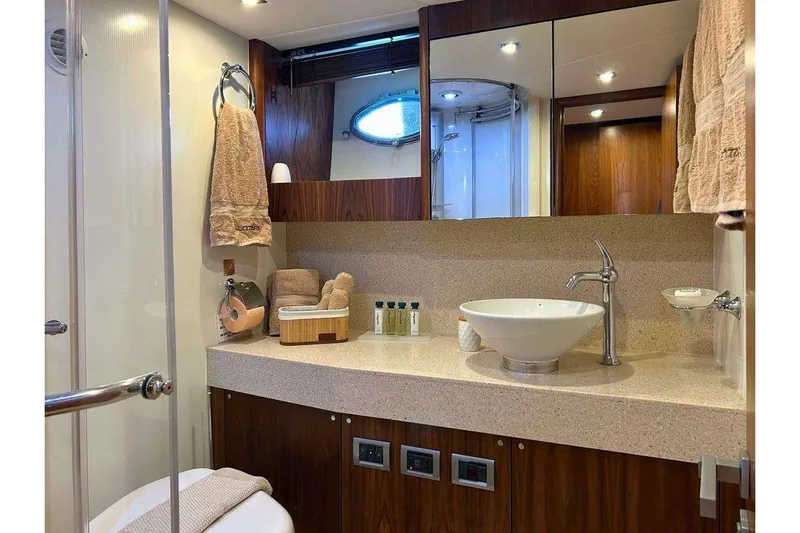 Elentari Yacht Photos Pics Luxurious bathroom in 2009 Sunseeker Predator 72 yacht with modern fixtures and elegant design.