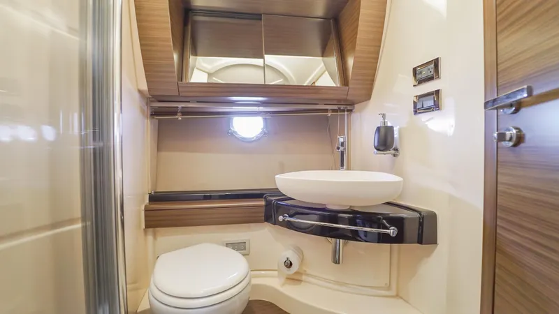 Brigadone Yacht Photos Pics Luxurious bathroom in 2016 Azimut 55S yacht with modern fixtures and elegant design.