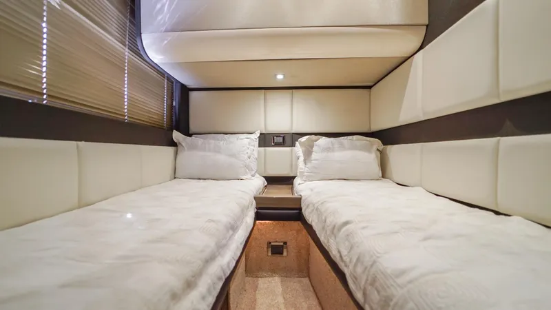 Brigadone Yacht Photos Pics Luxurious twin cabin interior of 2016 Azimut 55S yacht with plush bedding.