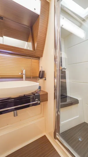 Brigadone Yacht Photos Pics Luxurious bathroom in 2016 Azimut 55S yacht with modern sink and glass shower.