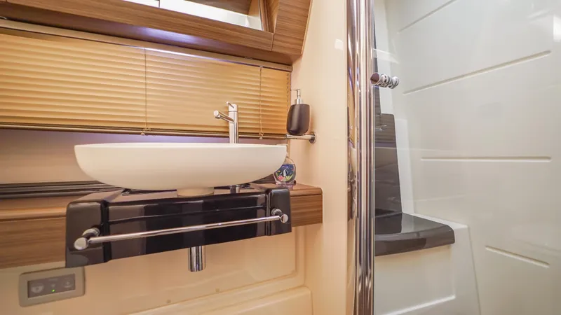 Brigadone Yacht Photos Pics Luxurious bathroom in 2016 Azimut 55S yacht with modern sink and shower.
