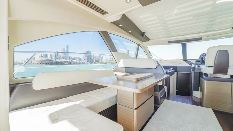 Brigadone Yacht Photos Pics Luxurious interior of 2016 Azimut 55S yacht with city skyline view.
