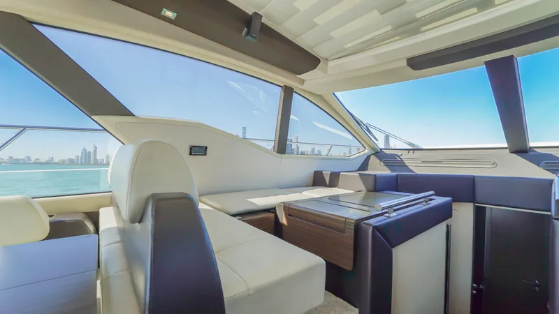 Brigadone Yacht Photos Pics Interior of 2016 Azimut 55S yacht with modern seating and panoramic windows.
