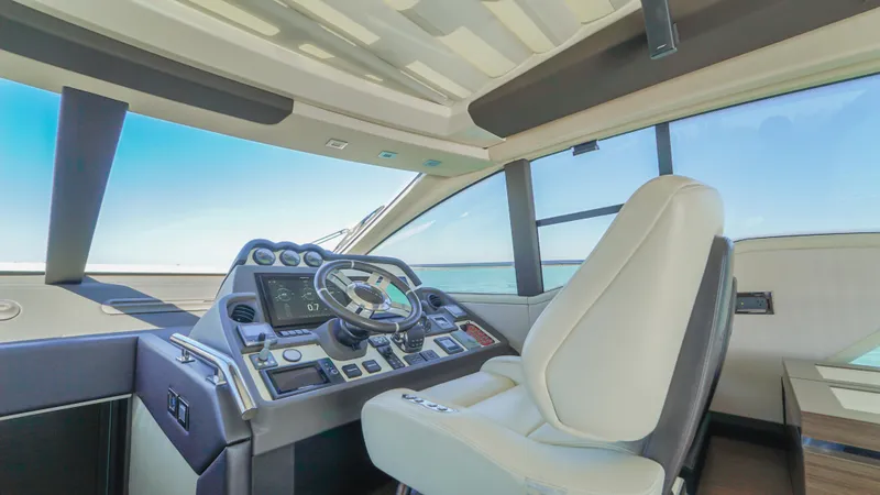 Brigadone Yacht Photos Pics 2016 Azimut 55S yacht helm with modern controls and luxurious seating.