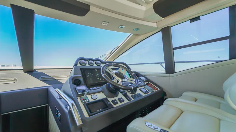 Brigadone Yacht Photos Pics Luxurious 2016 Azimut 55S yacht cockpit with modern controls and leather seating.