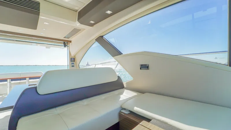 Brigadone Yacht Photos Pics Interior of 2016 Azimut 55S yacht with modern seating and ocean view.