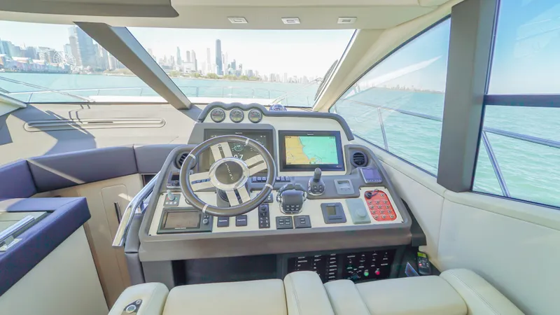 Brigadone Yacht Photos Pics 2016 Azimut 55S yacht helm with city skyline view.