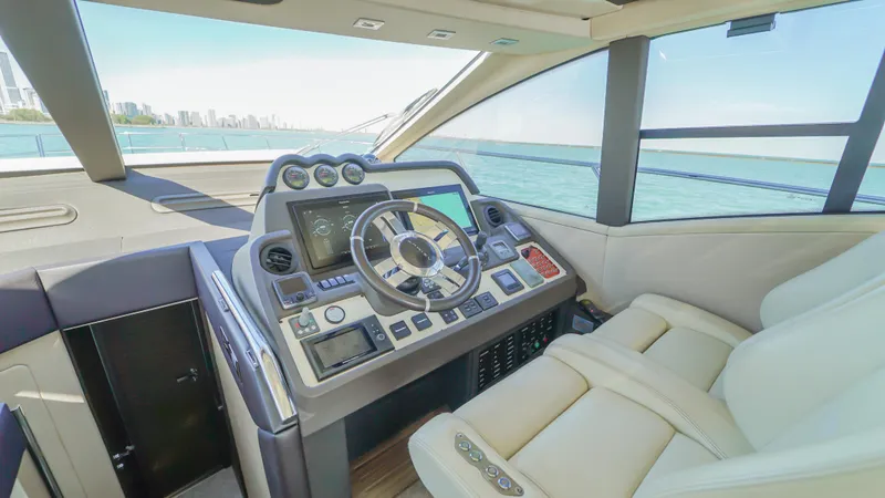 Brigadone Yacht Photos Pics Luxurious 2016 Azimut 55S yacht cockpit with modern navigation controls and panoramic views.