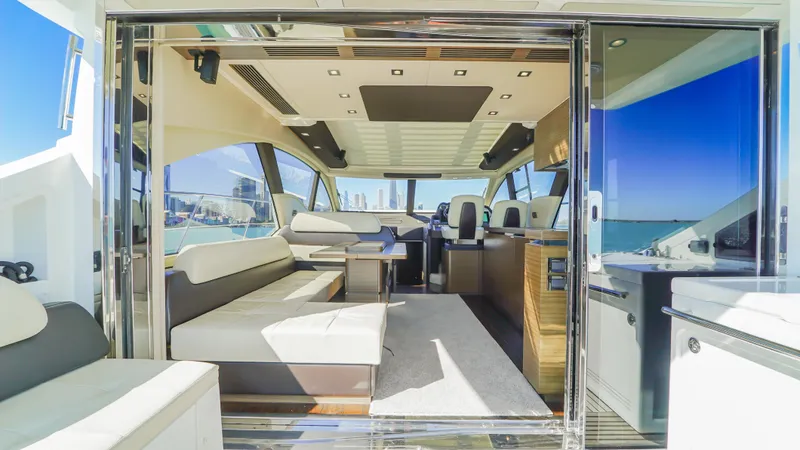 Brigadone Yacht Photos Pics Luxurious interior of a 2016 Azimut 55S yacht with modern seating and ocean view.