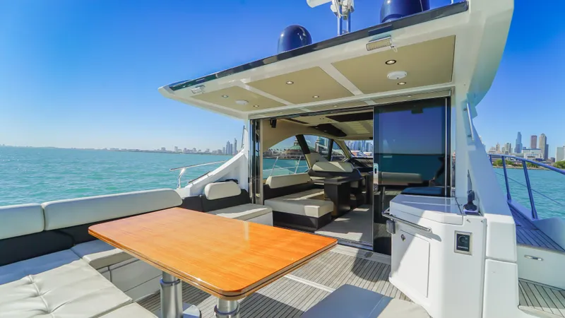 Brigadone Yacht Photos Pics 2016 Azimut 55S yacht with spacious deck, modern interior, and scenic ocean view.