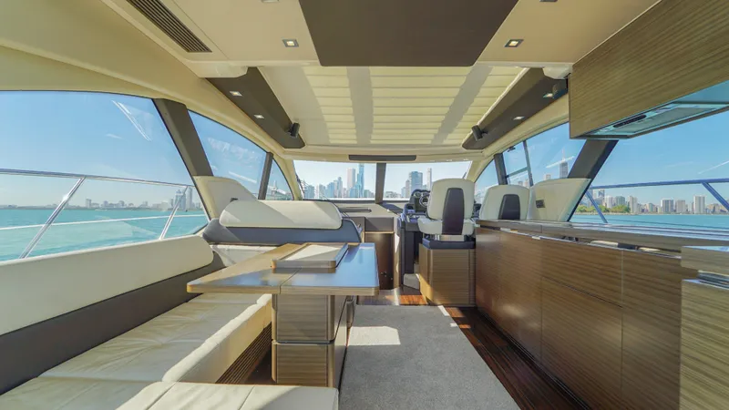 Brigadone Yacht Photos Pics Luxurious interior of 2016 Azimut 55S yacht with city skyline view.