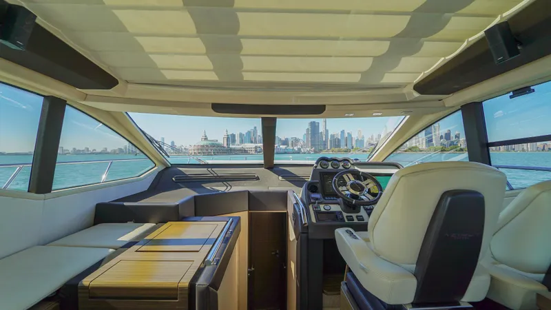 Brigadone Yacht Photos Pics Interior view of 2016 Azimut 55S yacht with city skyline in background.