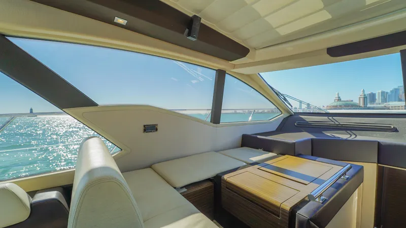 Brigadone Yacht Photos Pics Luxurious interior of 2016 Azimut 55S yacht with scenic ocean view through large windows.