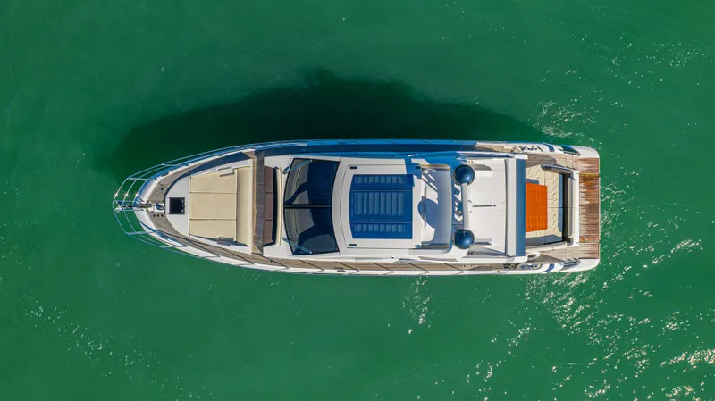 Brigadone Yacht Photos Pics Aerial view of 2016 Azimut 55S yacht on turquoise water.