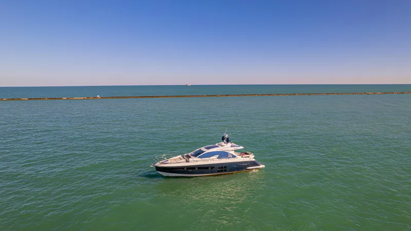 Brigadone Yacht Photos Pics 2016 Azimut 55S yacht cruising on calm blue waters under clear sky.