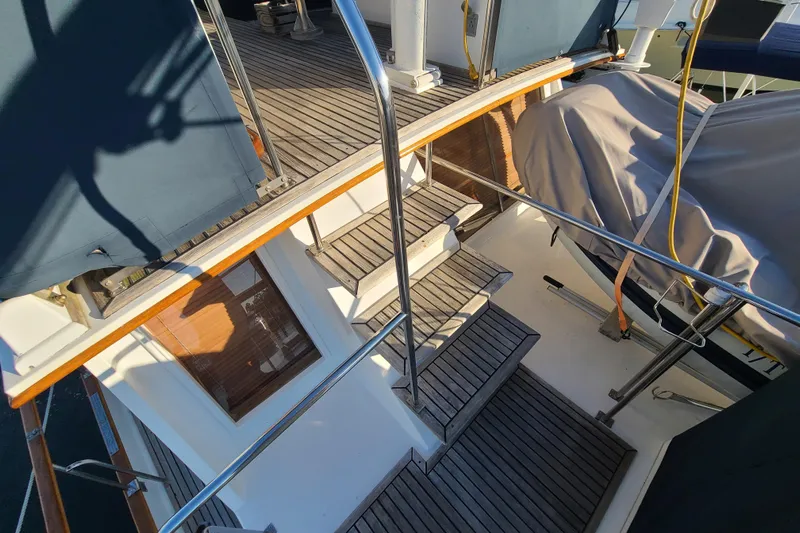 Breakaway Yacht Photos Pics Staircase on 2000 Grand Banks 46 Classic yacht with wooden deck and covered equipment.