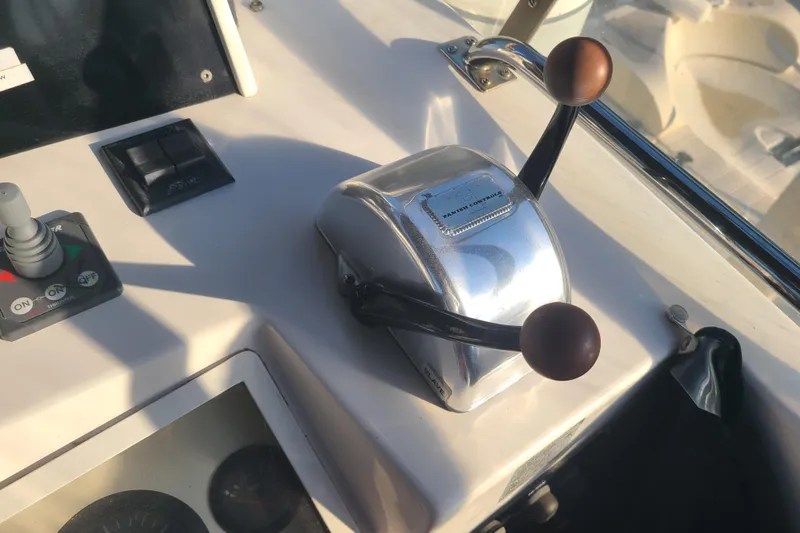 Breakaway Yacht Photos Pics Control panel of a 2000 Grand Banks 46 Classic yacht with throttle levers.